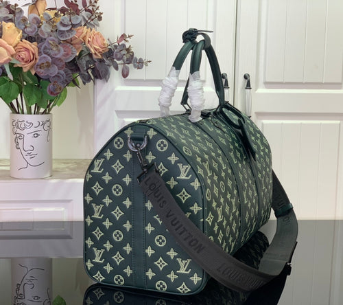 Louis Vuitton green monogram duffel bag side view with crossbody strap