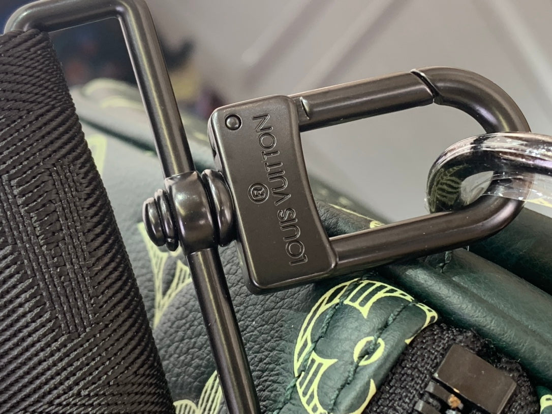Louis Vuitton metal clasp and D-ring on green monogram duffel strap