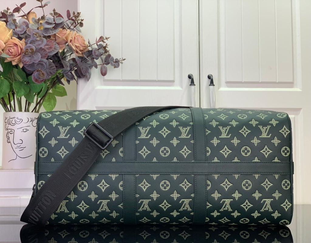 Louis Vuitton green monogram duffel bag with adjustable shoulder strap and flap