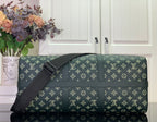 Louis Vuitton duffel bag with crossbody strap and gold monogram on dark green