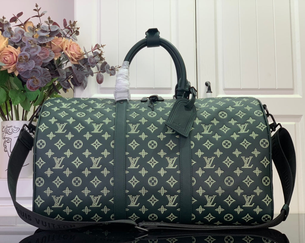Louis Vuitton green monogram duffel bag with top handles and shoulder strap