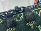 Louis Vuitton green monogram duffel bag zipper pulls with LV charms