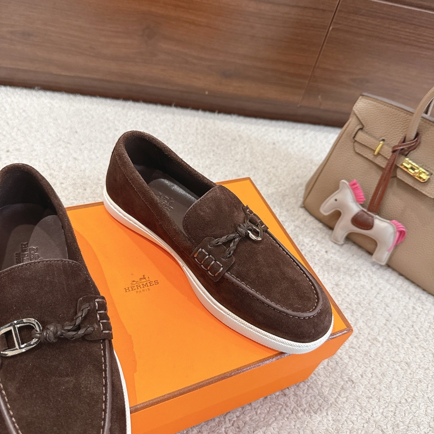 Hermes unisex suede loafer, dark brown with metal buckle detail and white sole