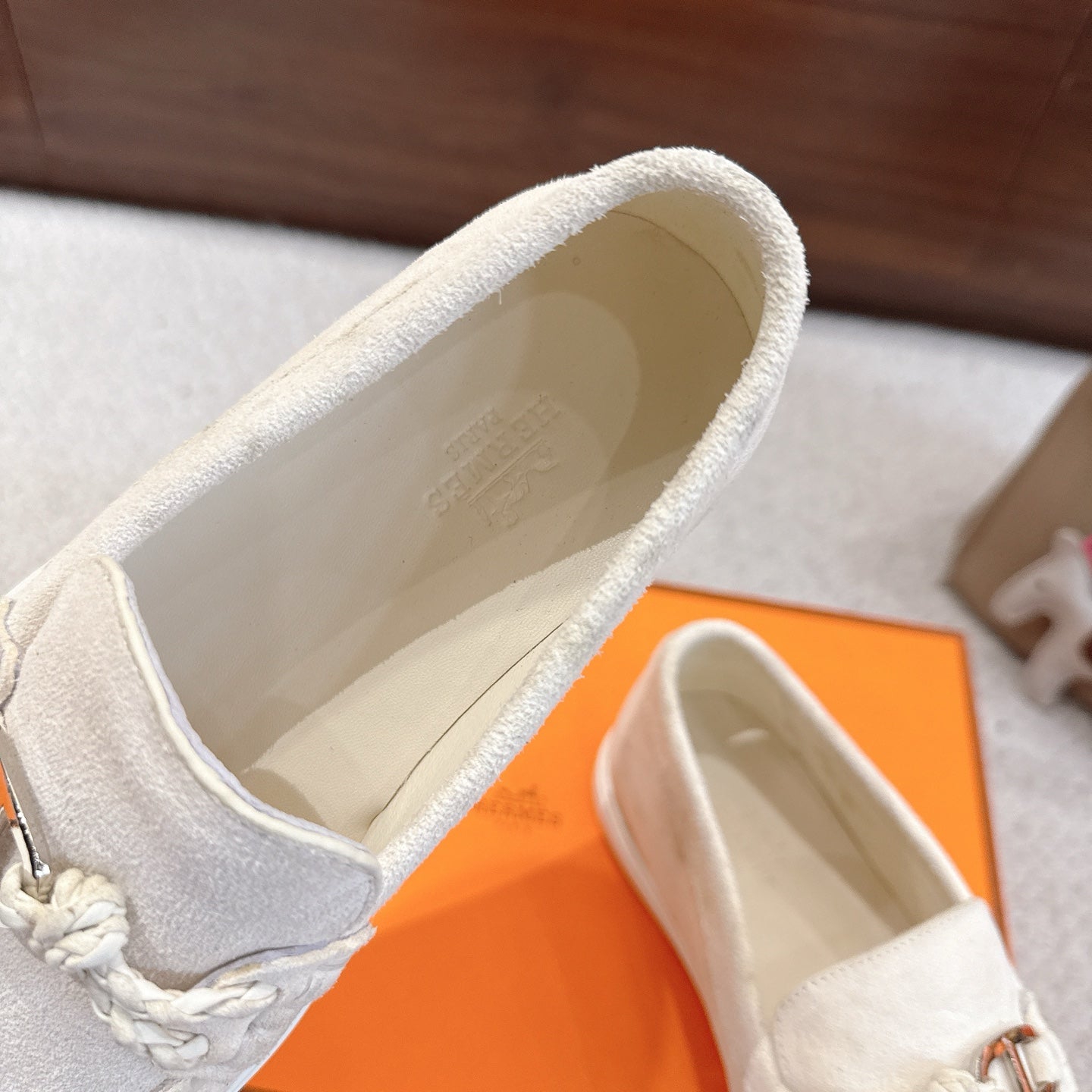 Hermes unisex white suede loafers, interior view showing stitched lining and top edge