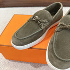 Hermes suede loafers in dark olive green with stitched laces and white rubber sole
