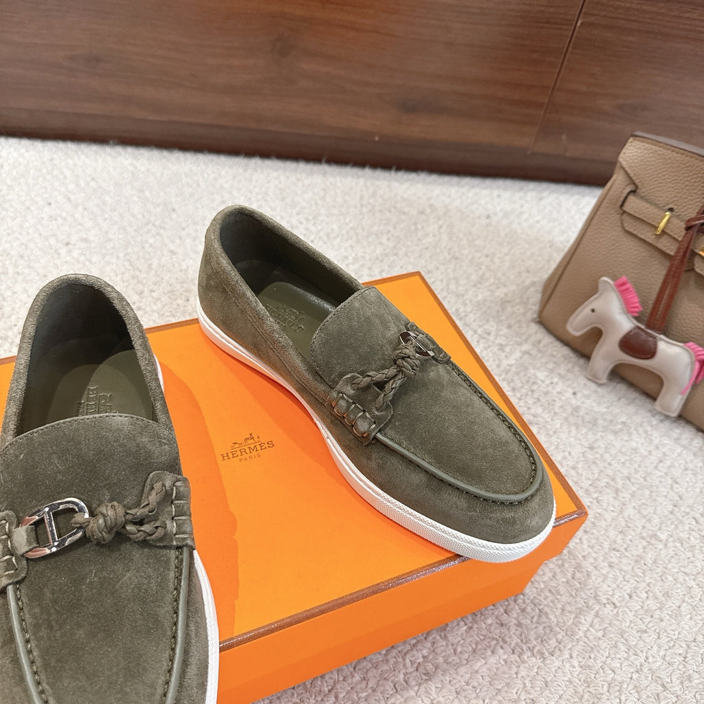 Hermes suede loafers, dark olive green, metal bit and braided laces; angled side view