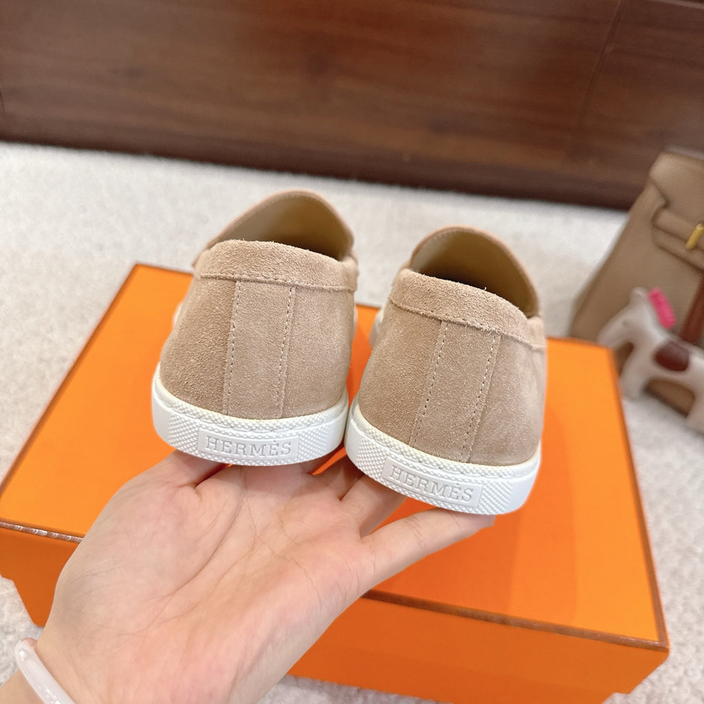 Hermes unisex suede loafers, beige heel view with white rubber sole
