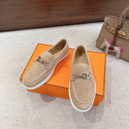 Hermes unisex suede loafers, beige side profile with metal bit and braided cords, white sole
