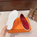 Hermes unisex red suede loafers with textured white outsole and metal H bit
