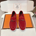Hermes unisex suede loafers in red with white rubber sole and metal H bit
