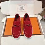 Hermes unisex suede loafers in red with white rubber sole and metal H bit
