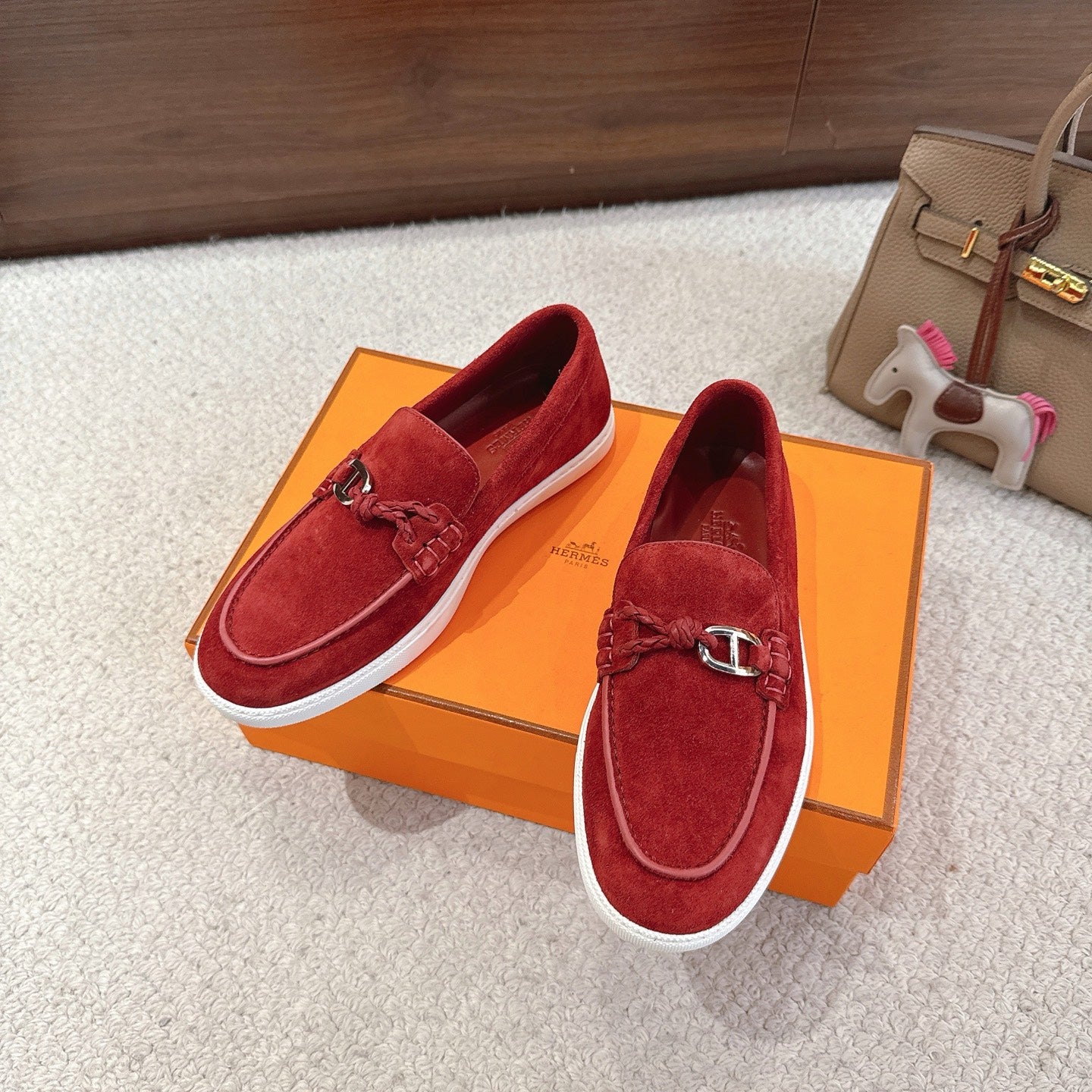 Hermes unisex suede loafers in red, braided moccasin top with metal H bit and white sole