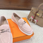 Hermes unisex light pink suede slip-on loafers with silver-toned horsebit and braided trim.