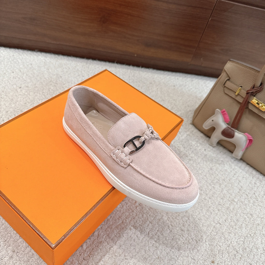 Hermes unisex light pink suede loafer, silver-toned horsebit with braided fastening, white sole.