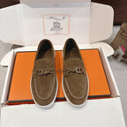 Suede slip-on loafers with metal bit detail and white rubber sole, dark olive.