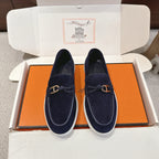 Hermes unisex navy suede loafers with gold-tone bit, braided detail, white sole