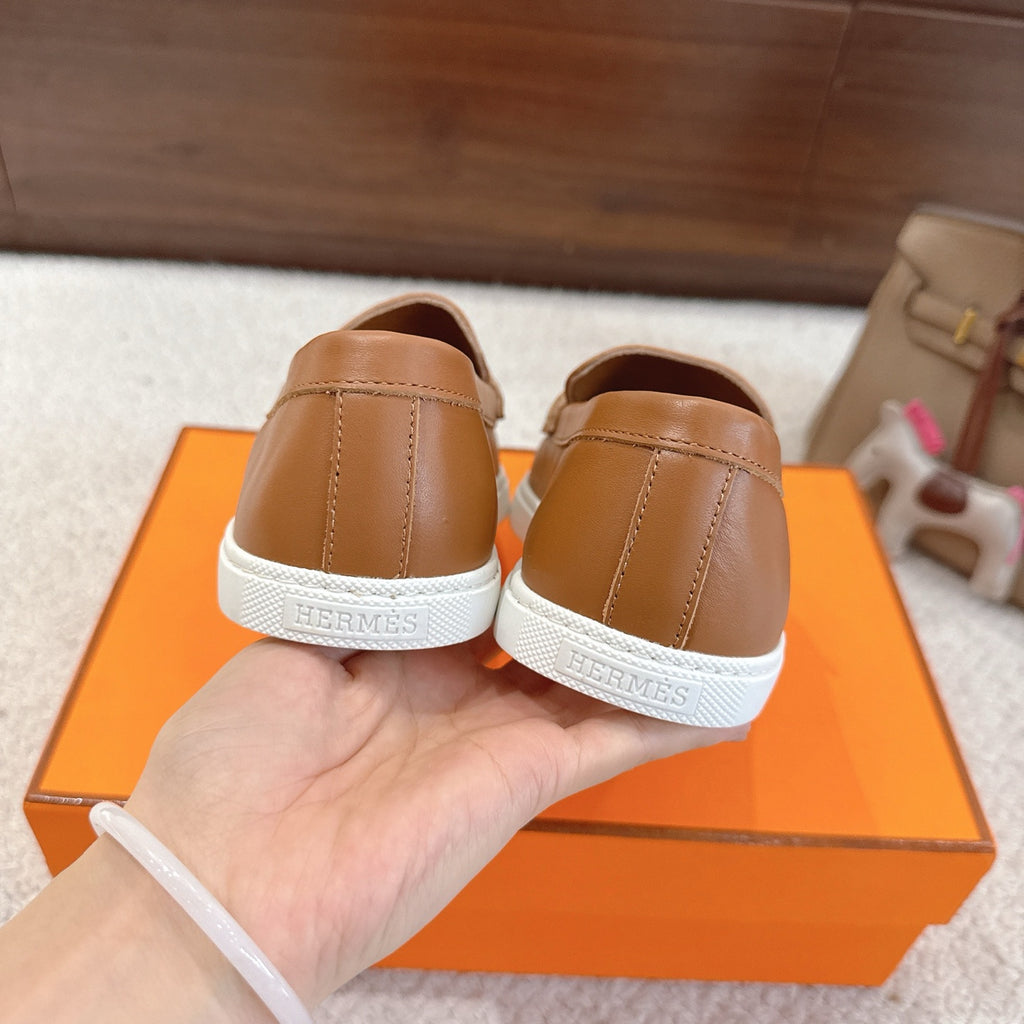 Hermes unisex tan leather loafers with white sole and back seam detail