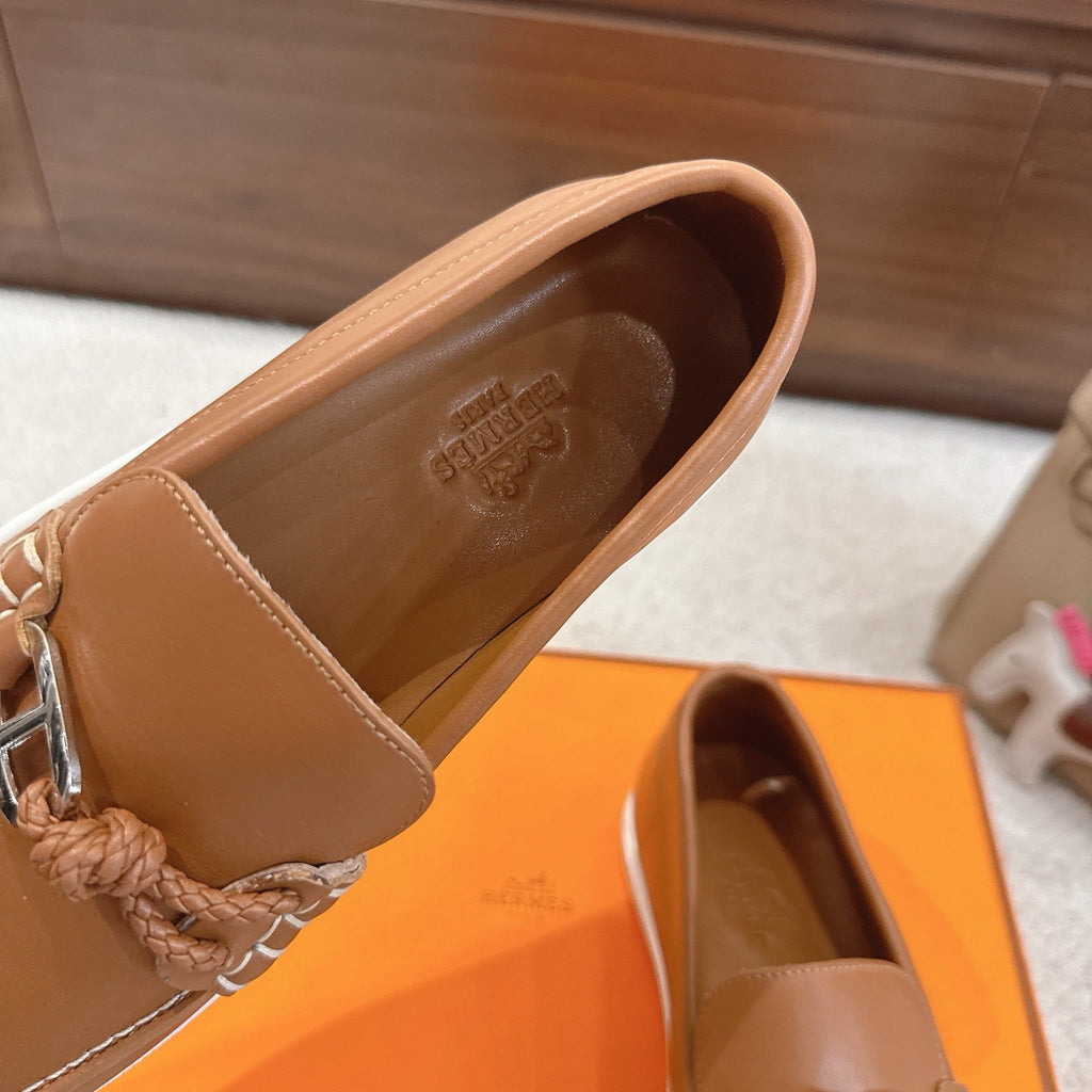 Hermes unisex tan leather loafer interior view with stitched vamp and logo embossing