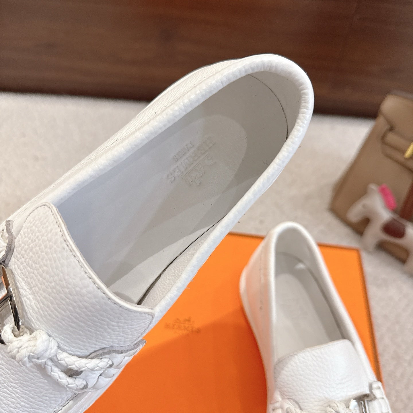 White leather loafer interior opening with stitched edge and cushioned lining