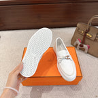 White leather loafer outsole showing textured tread and size marking