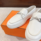 White leather loafer with metal horsebit and braided lace detail, slip-on