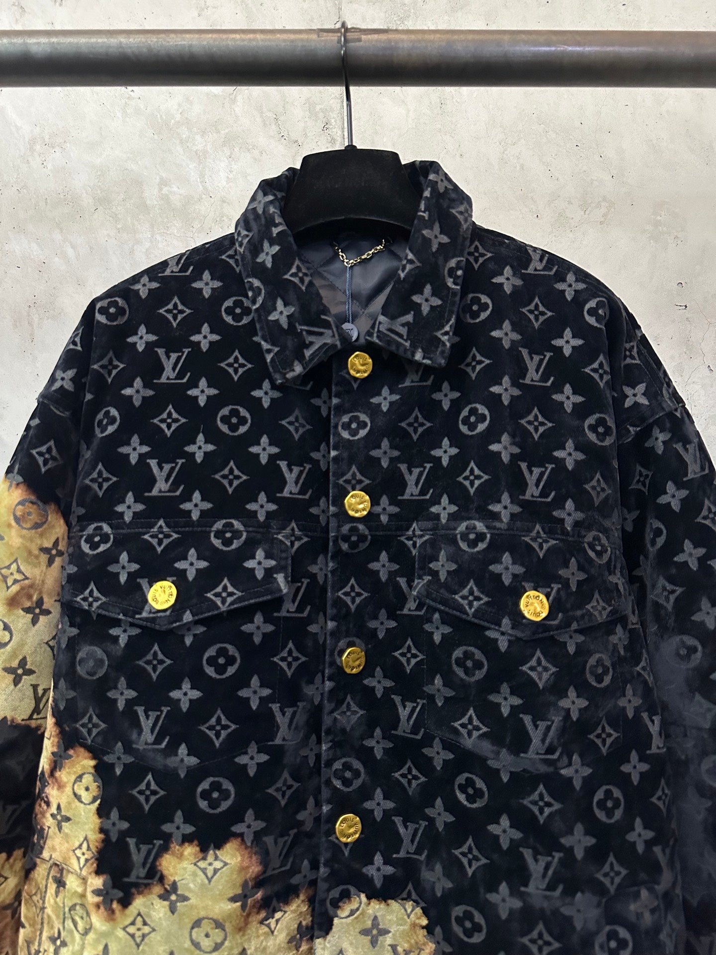 Long jacket front view with dark monogram pattern and gold-button placket