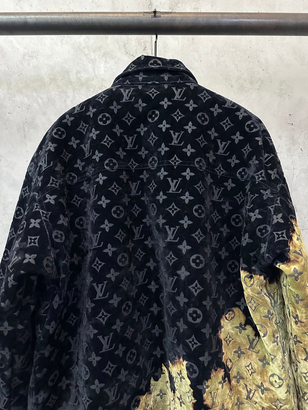 Long jacket back view with dark monogram pattern and gold textured right side