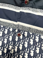 Puffer vest button placket with white stripe and logo print lower panel