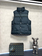 Sleeveless puffer vest with front snap buttons, dark body, logo trim hem