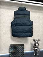 Sleeveless puffer vest back view, dark quilted body, logo trim hem