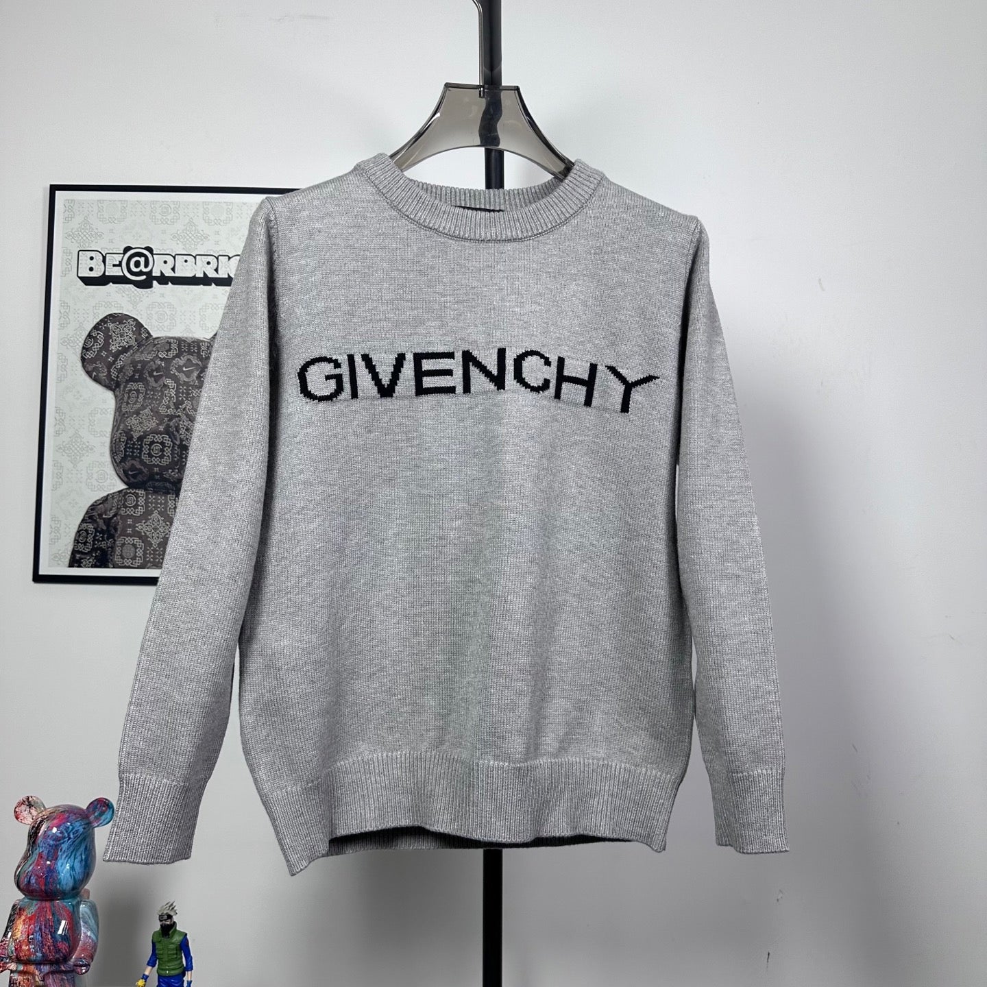 Grey knit crewneck sweater with bold black GIVENCHY logo on front