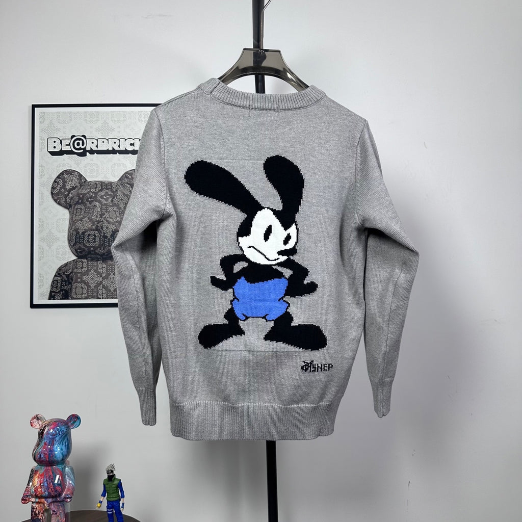 Grey knit crewneck sweater with Mickey Mouse graphic and blue shorts