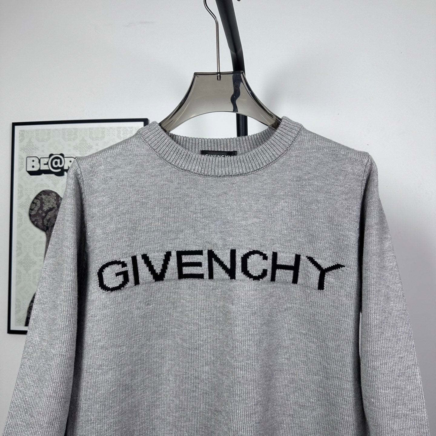 Grey knit crewneck sweater with centered black GIVENCHY logo
