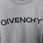 Grey knit sweater neckline with black GIVENCHY logo text across chest