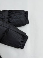Dior long puffer jacket close-up of sleeves and cuffs in dark monogram fabric