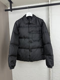Dior long puffer jacket in dark black with stand collar and quilted paneling