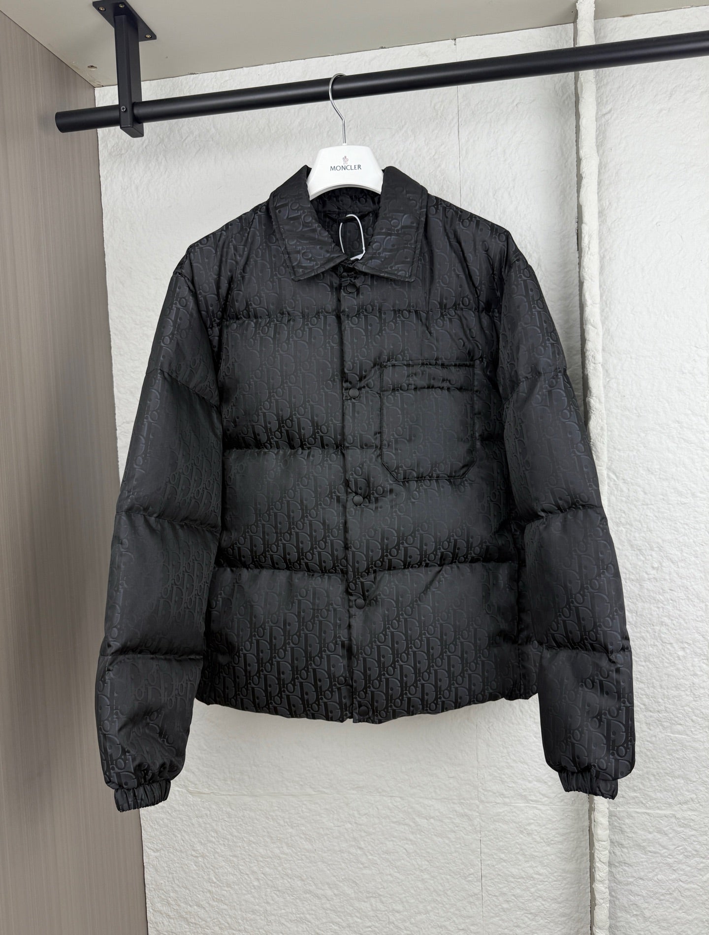 Dior long puffer jacket in dark black with stand collar and quilted paneling