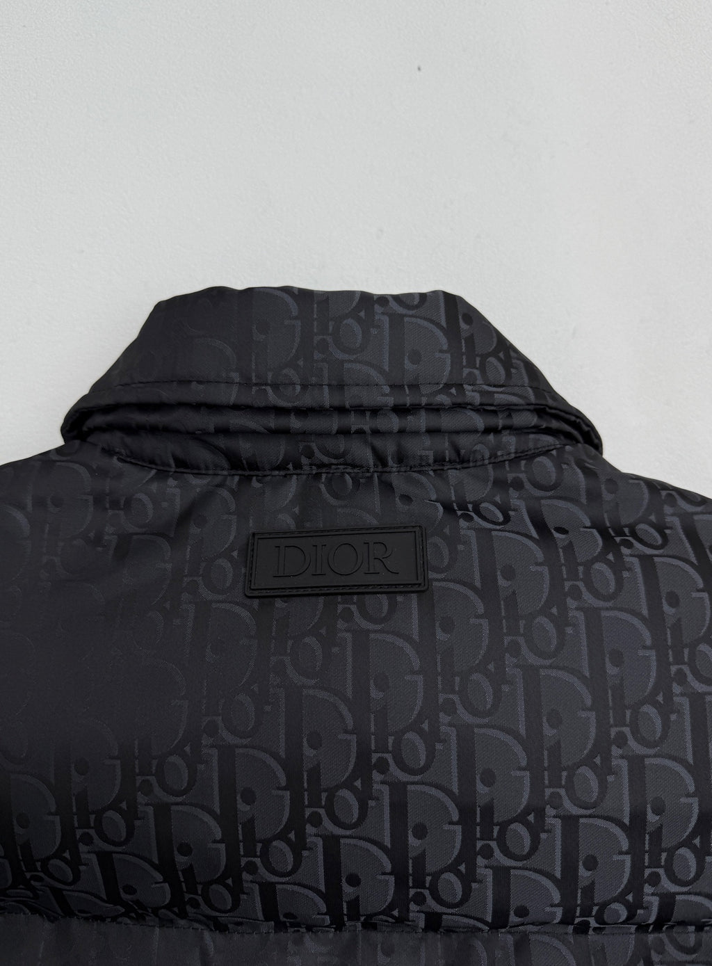 Dior long puffer jacket hood/back with DIOR logo patch on dark monogram fabric