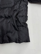 Dior long puffer jacket side view with gathered quilting and dark monogram pattern