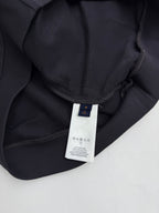 Black hoodie neckline with inner brand label and drawstring channel
