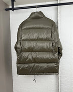 Prada long puffer jacket back view in olive with quilted horizontal panels