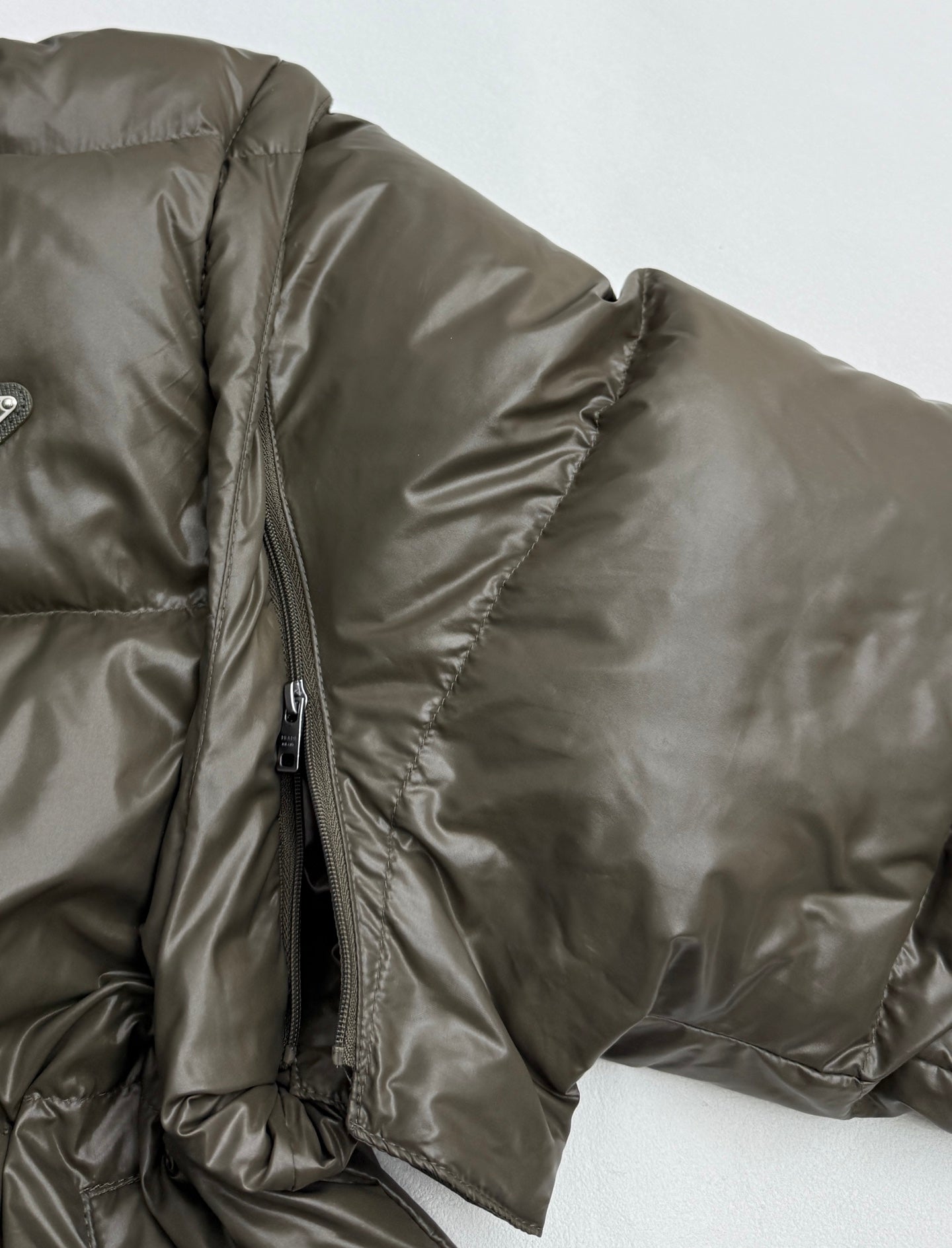 Prada puffer sleeve with side zipper and adjustable cuff in olive