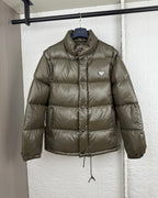 Prada long puffer jacket in olive with stand collar and button placket
