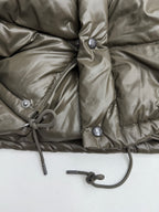 Prada puffer jacket front with snap placket and drawstring cord at hem