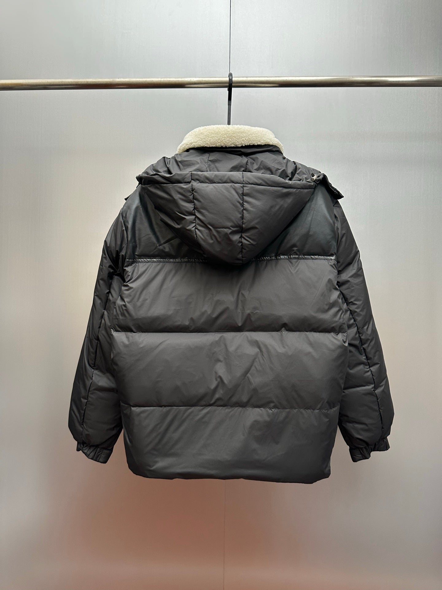 Moncler long puffer jacket, back view, faux shearling hood and center back zip