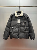 Moncler long puffer jacket with faux shearling hood, front zip, chest logo patch