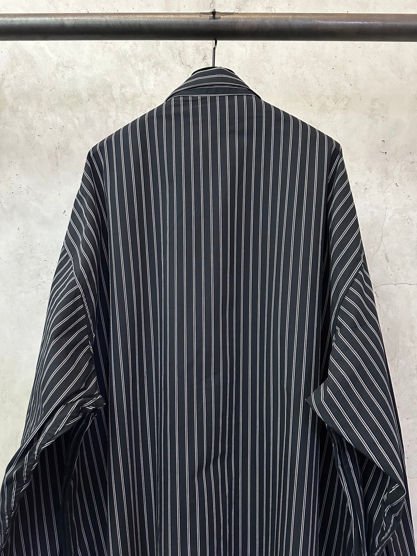 Long-sleeve striped button-up shirt, dark navy with white vertical stripes, back neckline