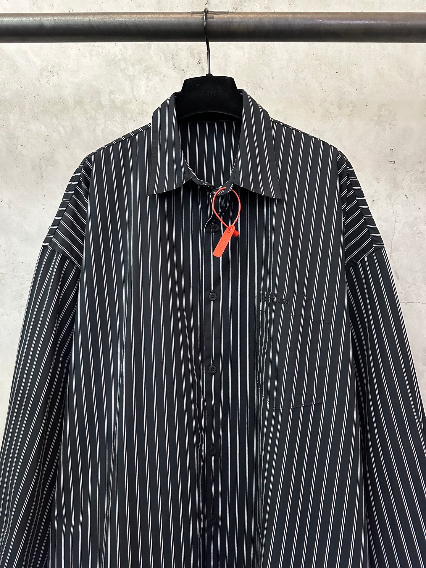 Long-sleeve striped button-up shirt with point collar, dark navy and white pinstripes