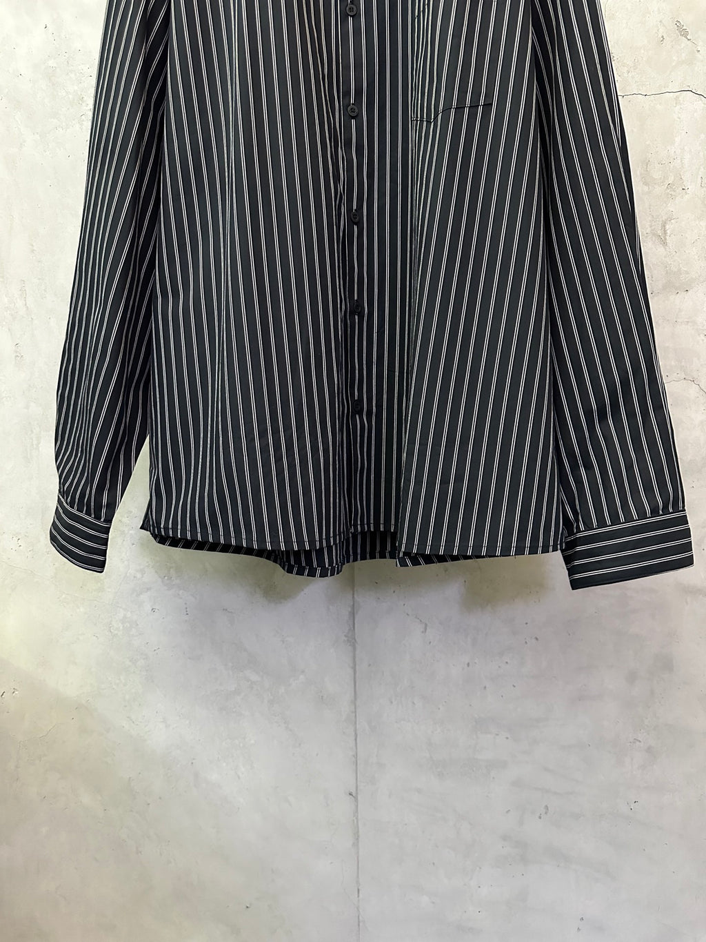 Long-sleeve striped button-up shirt, dark navy with white vertical stripes, button front