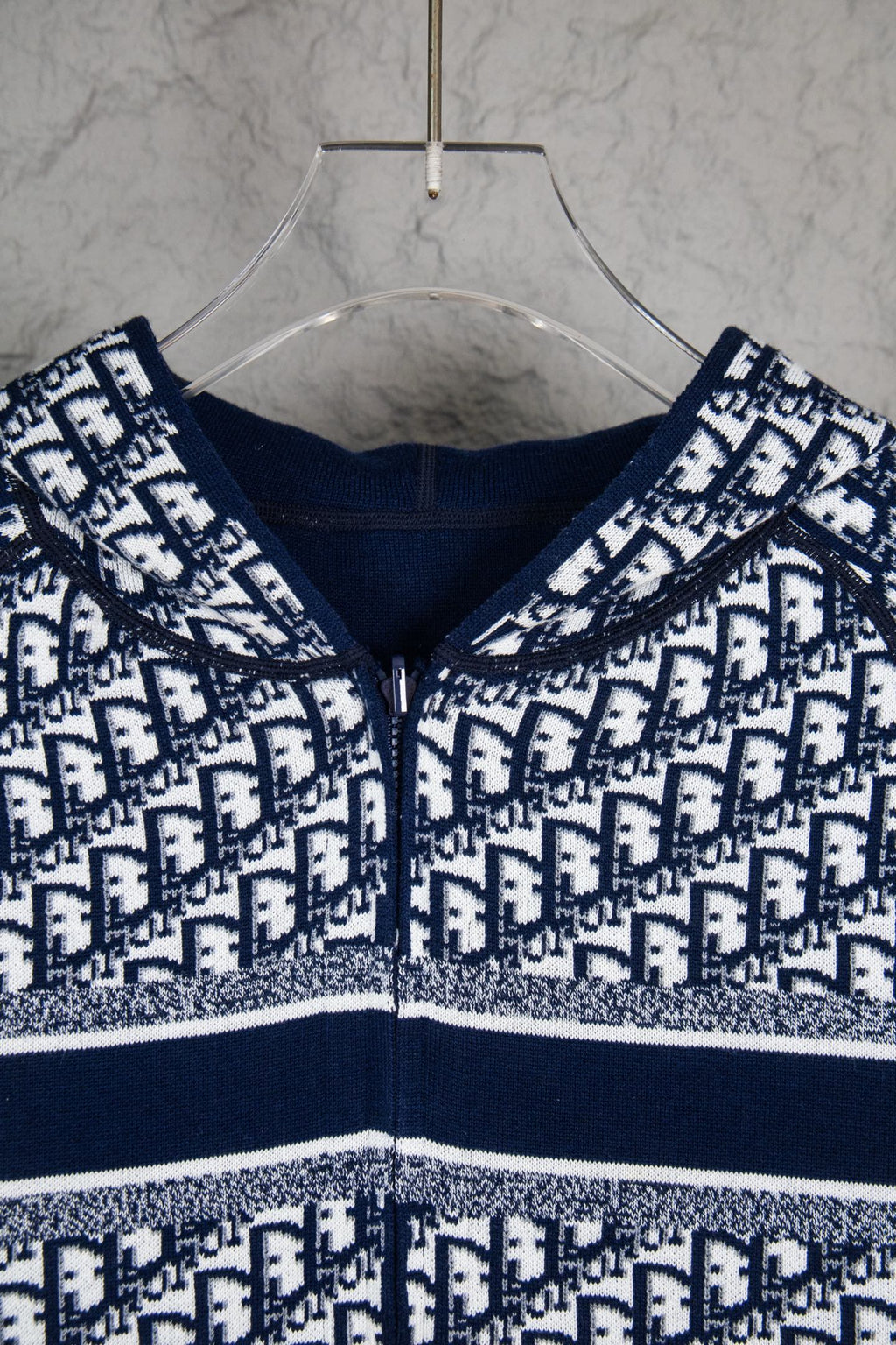 Dior long-sleeve knit sweater close-up, navy crew neck and monogram pattern